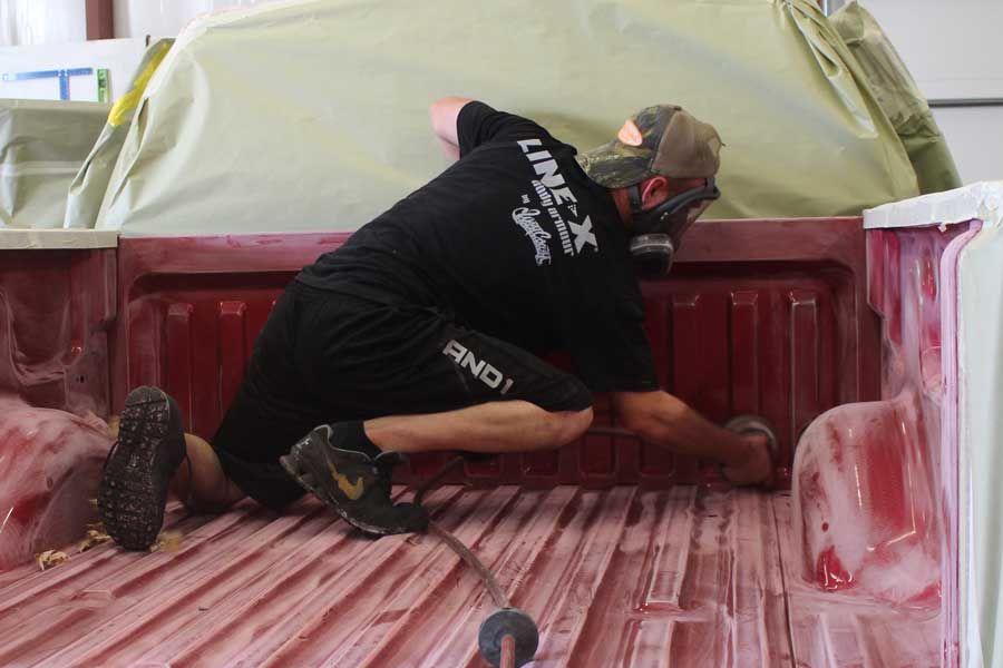 Man cleaning truck bed